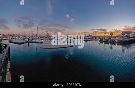 View over the marina of Playa Blanca on Lanzarote during sunset in springtime Stock Photo