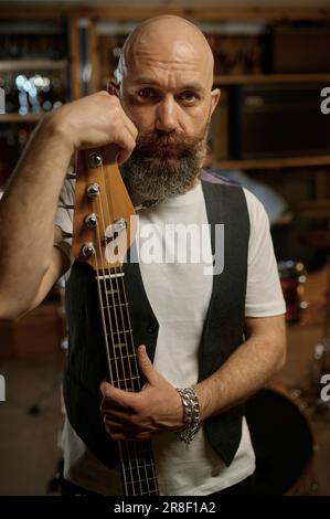 Portrait of rock band guitarist with his music instrument Stock Photo