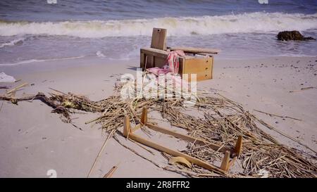 Furniture and other drifting debris has reached Black Sea beaches in Odessa, Ukraine. Environmental disaster caused by explosion of Kakhovka Stock Photo