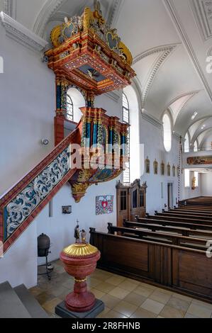Pulpit and baptismal font, Parish Church of St. Theodor and Alexander in Haldenwang, Allgaeu, Bavaria, Germany Stock Photo