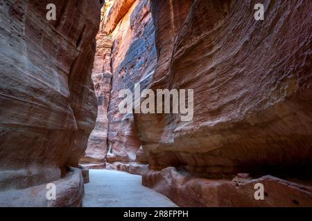 A section of the Siq at the ancient site of Petra in Jordan showing former one kilometer long channels which supplied the city with water. Stock Photo