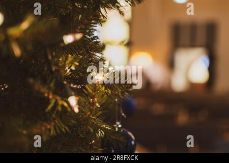 A close-up image of a festive Christmas tree, with its decorations and ornaments visible Stock Photo