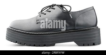 Black leather boot with shoelaces bow. Isolated on white background with clipping path. Full Depth of Field Stock Photo