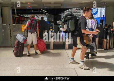 London UK. 21 June 2023  Revellers with back packs and camping gear prepare to depart from Waterloo station for the Glastonbury festival which takes place over five days from 20-25 June in Pilton Somerset .Credit: amer ghazzal/Alamy Live News Stock Photo