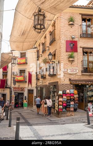 Toledo shopping, view of people walking in the Calle Cardenal Cisneros, a popular shopping street in the historic Old Town area of Toledo, Spain Stock Photo