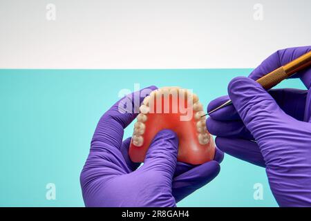 Dental Technician Making Handmade Dental Prosthesis In A Work Shop Stock Photo