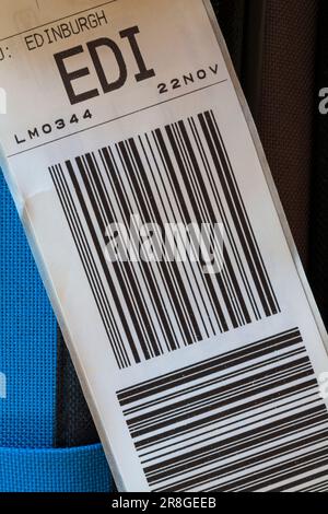 luggage label stuck on case for EDI Edinburgh airport in Scotland Stock Photo