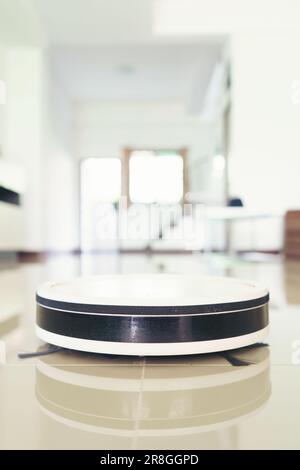 home vacuum cleaning robot cleaning the room Stock Photo