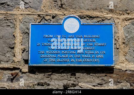 An historic plaque at the site of the original Post Office on Horse Street in Lyme Regis on the Jurassic Coast, Dorset, England, UK Stock Photo