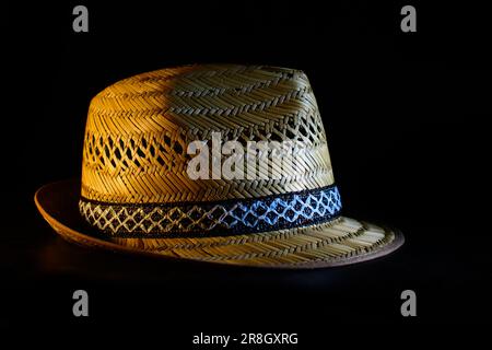 Handmade straw hat isolated on black background Stock Photo