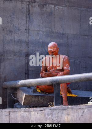 Varanasi, India - March 2023: Portrait of an foreign female tourist practicing yoga meditation at assi ghat in varanasi during morning session. Stock Photo