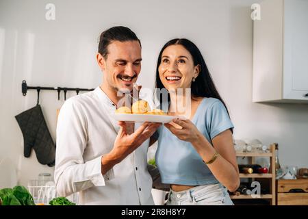 Healthy lovers cooking food in kitchen, Couple spending time together Stock Photo