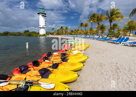 Kayak rentals and sandy beach on Harvest Caye - private island owned by Norwegian Cruise Line in Belize Stock Photo