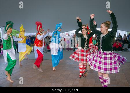 Dance Fusion collaboration with Highland and Punjabi Bhangra dancers, Scotfest,Town Centre Park, Coquitlam, British Columbia, Canada, Stock Photo