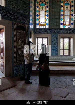 Family inside an Elegant room with stained glass windows inside the Topkapi Palace, Fatih district, Istanbul, Turkey Stock Photo