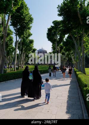 Visitors in the grounds of the Topkapi Palace, Fatih district, Istanbul, Turkey. Hagia Irene Church in the background Stock Photo