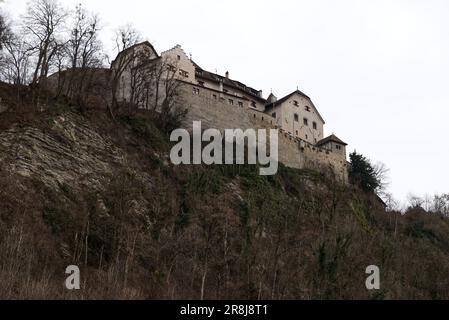 panoramic photo of perched vaduz castle below the liechtenstein alps Stock Photo