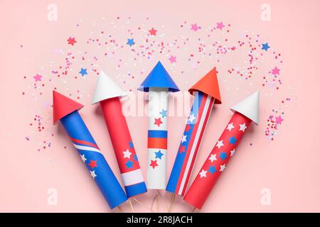 Firework rockets, serpentine and confetti for Independence Day on red ...