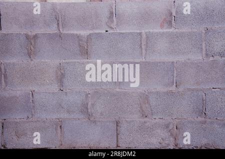 An isolated, close-up view of a textured brick wall, perfect for use as a background in a variety of creative projects Stock Photo