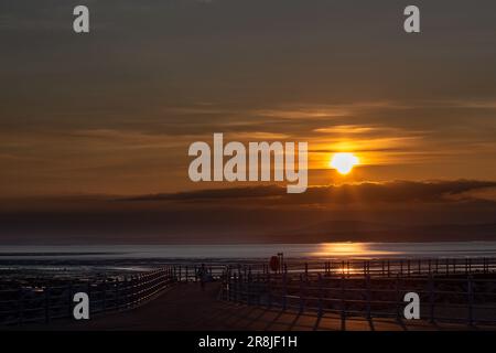 Heysham, Lancashire, United Kingdom. 21st June, 2023. The sun goes down across Morecambe Bay bringing to a close the longest day Credit: PN News/Alamy Live News Stock Photo
