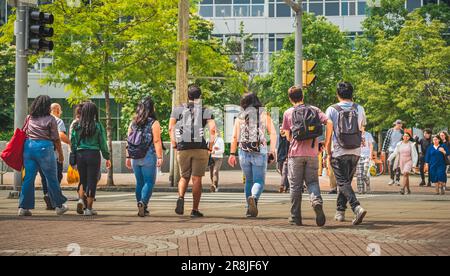 Walking people on the street. Crowd of anonymous people walking on busy Toronto street Canada. Pedestrian crossing walking on busy street-June 16,2023 Stock Photo