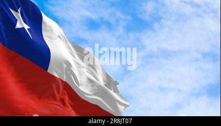 Chile national flags fluttering in the wind on a sunny day. The Chilean flag is red and white with a blue square and white 5-pointed star on the white Stock Photo