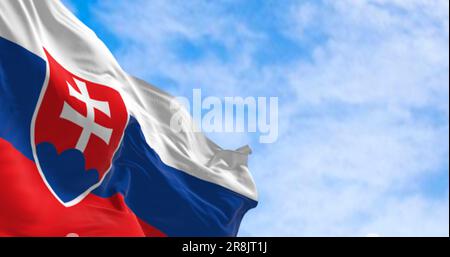 The national flag of Slovakia waving in the wind. Horizontal tricolor of white, blue, and red. National coat of arms at the hoist. 3d illustration ren Stock Photo