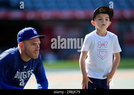 ATLANTA, GA - JUNE 25: Charlie Freeman, son of Los Angeles Dodgers first  baseman and former Brave Freddie Freeman (5) rides on his Dad's shoulders  before the Saturday evening MLB game between