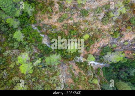 Waterfall of a ravine under the Penyagalera / Peñagalera in the Puertos of Beceite descending with a good flow after heavy rains. Beceite Teruel Spain Stock Photo