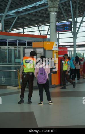 you can see the train security giving instructions to train passengers