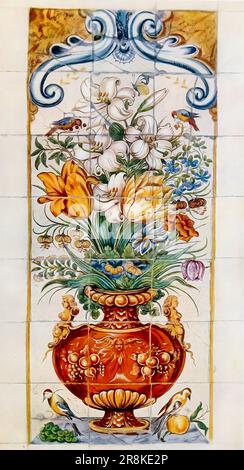 Tile-picture with a vase of flowers, in blue, yellow, brown, green and manganese-purple, formerly in a house in Rotterdam. Dutch ; first half of seventeenth century. from the book ' OLD DUTCH POTTERY AND TILES ' BY ELISABETH NEURDENBURG and translated by BERNARD RACKHAM published in London by Benn Brothers, limited in 1923 'Of this book 100 copies only for sale have been printed on English hand-made paper, bound in pigskin and signed by the Authoress and Translator. These copies also contain an extra colour plate. This is Number 81.' Stock Photo