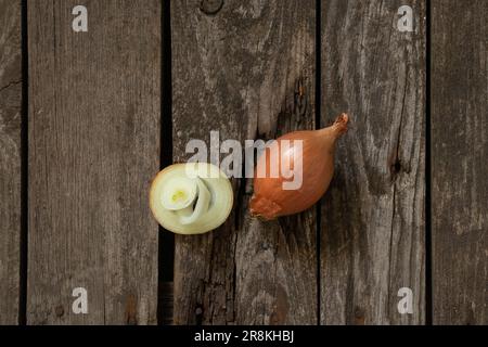 chopped onions lies on a wooden board Stock Photo