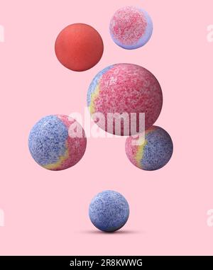 Many different bath bombs falling on pink background Stock Photo