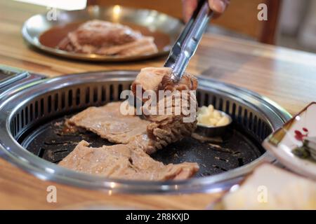 Korean pork ribs and beef marbled Korean BBQ style charcoal grill Stock Photo