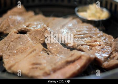 Korean pork ribs and beef marbled Korean BBQ style charcoal grill Stock Photo