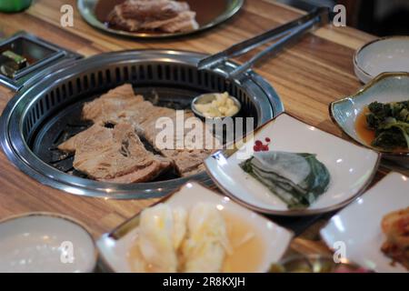 Korean pork ribs and beef marbled Korean BBQ style charcoal grill Stock Photo