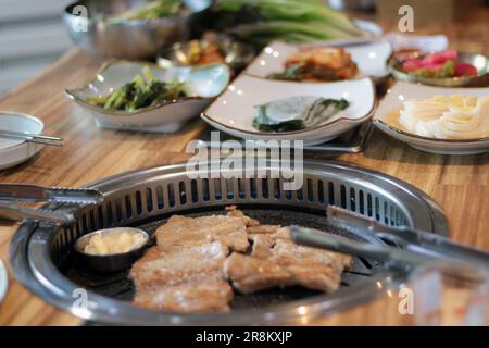 Korean pork ribs and beef marbled Korean BBQ style charcoal grill Stock Photo