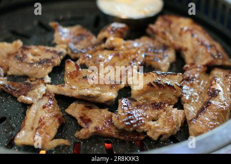 Korean pork ribs and beef marbled Korean BBQ style charcoal grill Stock Photo