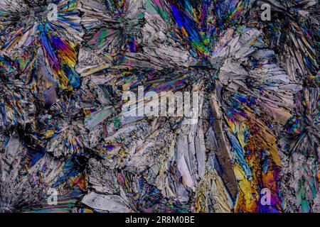 Sugar crystals photographed with polarized light at great magnification, creating an original color palette Stock Photo