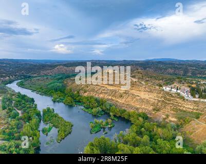 Aerial view of the meander of Flix with the castle on the top of the hill (Ribera de Ebro, Tarragona, Catalonia, Spain) ESP: Vista aérea del río Ebro Stock Photo