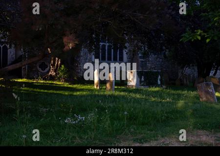 Rye East Sussex , England UK -  The sun glints through the graveyard at St Mary's Church in the town centre Stock Photo