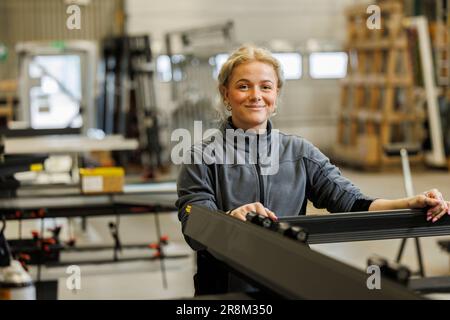Young woman working in factory Stock Photo