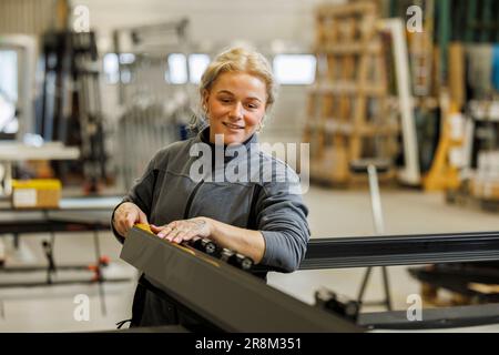 Young woman working in factory Stock Photo