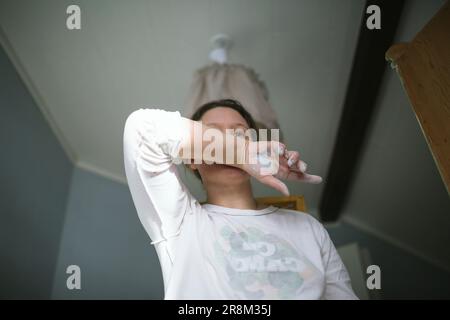 Woman with paint on her hand Stock Photo