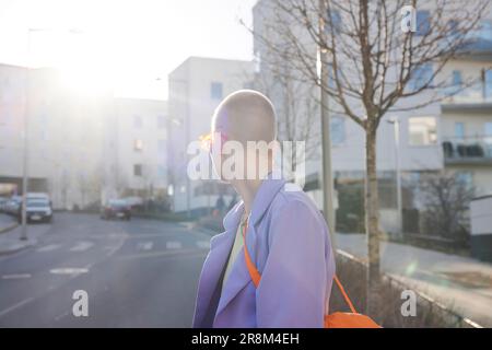 Side view of short-haired woman looking at street Stock Photo