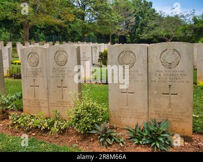 Two pairs of headstones of Commonwealth War Graves at the Trincomalee War Cemetery in Sri Lanka. The men are of the Royal Marines who died on 9th Apri Stock Photo