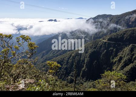 Driving the famous death road, the 'Camino de la Muerte', in the Bolivian Andes near La Paz - traveling and exploring the Yungas Stock Photo