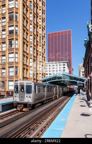 Chicago, United States - May 2, 2023: Chicago 'L' Elevated Metro rapid rail transit train public transport at Library station portrait format in Chica Stock Photo