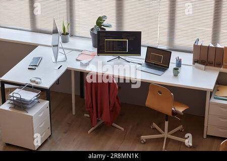 High angle view at modern office workplace with two computers on table, IT programming concepts Stock Photo