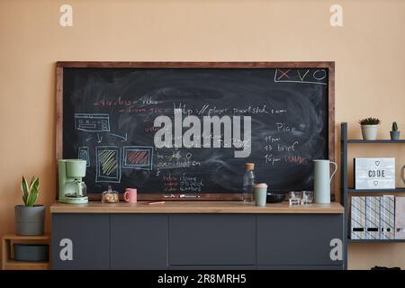Background image of blackboard with code lines in chalk at coffee station in modern office, copy space Stock Photo
